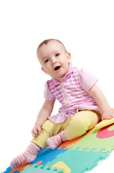 Shot of little cute baby playing with letters