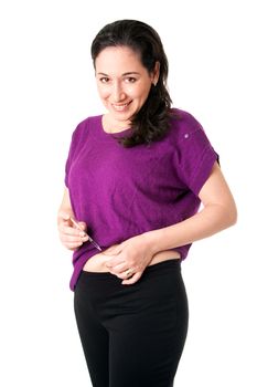 Attractive happy diabetic woman injecting insulin in her belly for health, isolated.