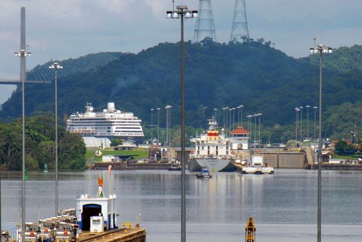 PANAMA-SEPTEMBER 10. Cargo ship and cruiser crosses on September 10, 2006 in Panama Canal. Located at the narrowest point between the Atlantic and Pacific oceans, the canal has had a far-reaching effect on world economic development.