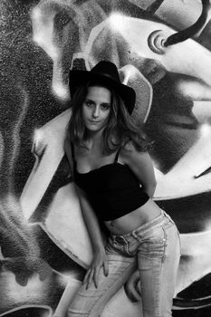 cowboy fashion girl in graffiti background