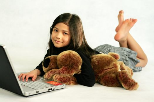Eight years old girl on laptop
