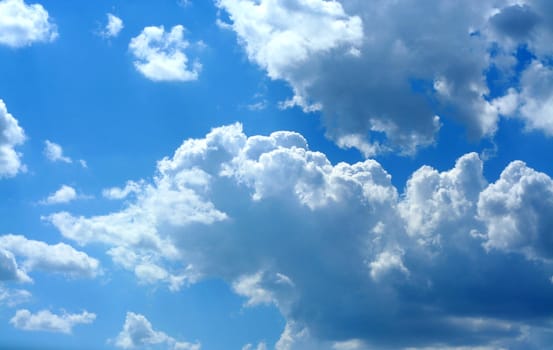 Bright blue skies and fluffy white clouds