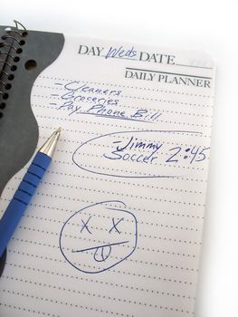 A busy daily schedule book of a modern mom or dad.