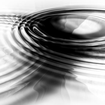 two abstract liquid ripples joining together