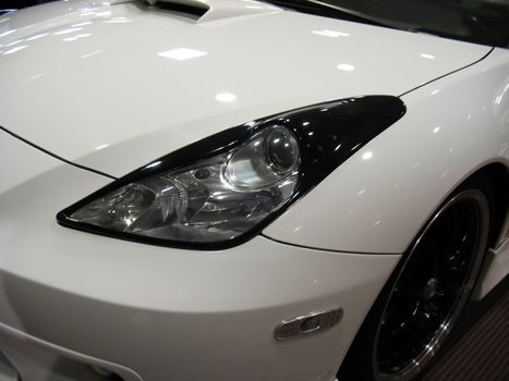 a detail shot of a sports car headlight