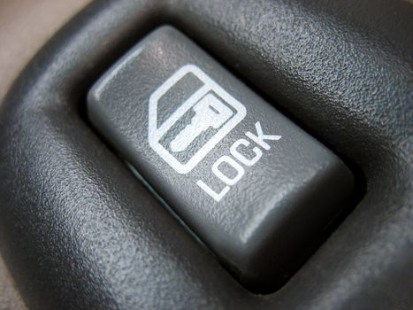 a car door lock button - macro