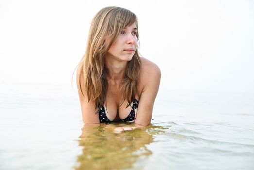 Young woman lying on a beach