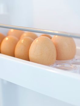 close up of fresh chicken eggs in the fridge