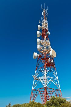 Communications tower with a beautiful blue sky