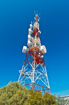 Communications tower with a beautiful blue sky