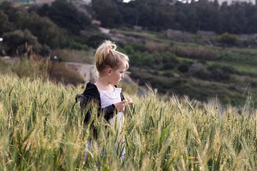 Girl looking at the view in a field
