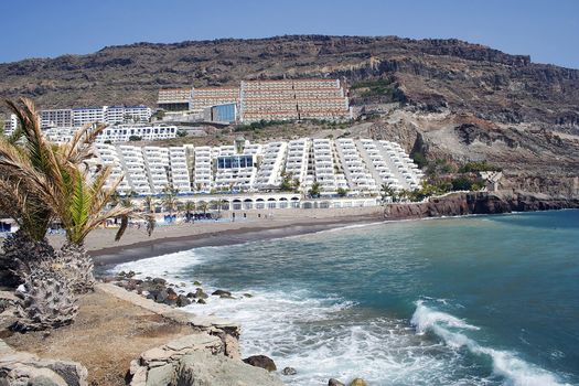 The beach and sea front at playa taurito in Gran Canaria