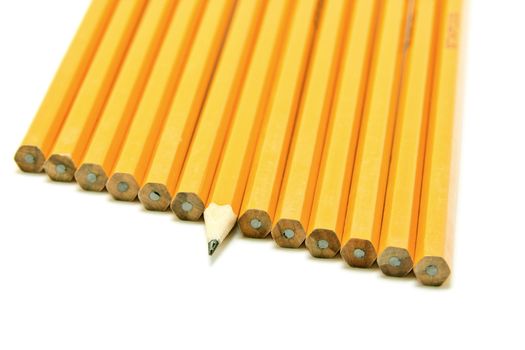 a sharp pencil sticking out form a croud of dull pencils