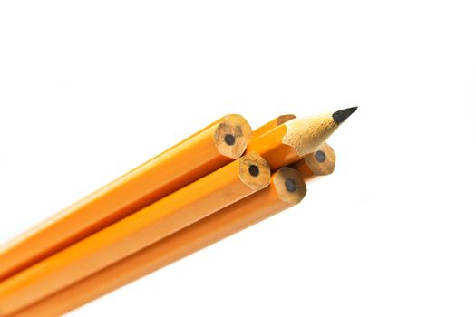 a sharp pencil sticking out form a croud of dull pencils