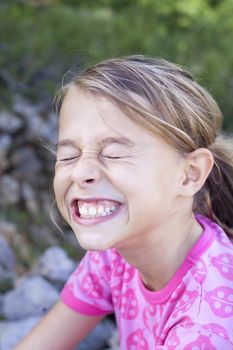 A young girl pulling a funny face
