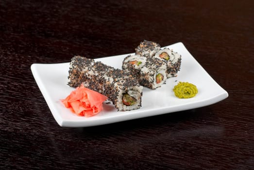 Closeup of Sushi rolls at plate with sesame