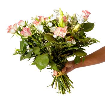 A womans hand is holding a bouquet of flowers isolated on white background