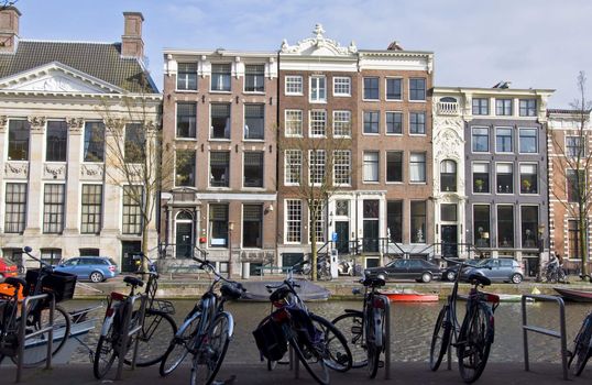 Amsterdam residential houses and bicycle. Spring cityscape