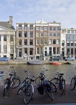 Amsterdam residential houses and bicycle. Spring cityscape