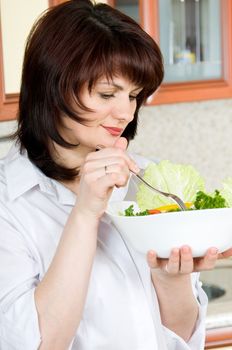 Beautiful a woman  to taste  cooked the food