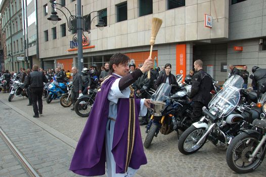 WROCLAW, POLAND - April 16: Motorcycle parade and season opening in Poland. Riders gather to enjoy new season and collect blood for children in hospitals. Priest blessing on April 16, 2011.