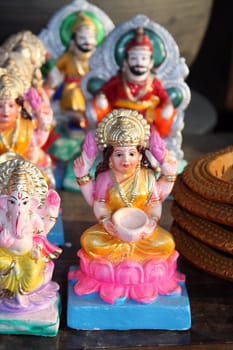 An idol of goddess laxmi along with other mythological and historical figures from Hinduism, at a potters shop.