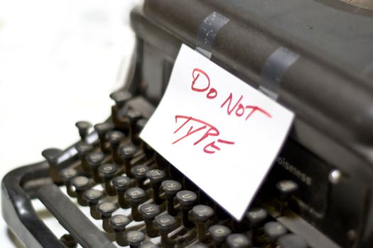 A symbolic shot of a typewriter with DO NOT TYPE