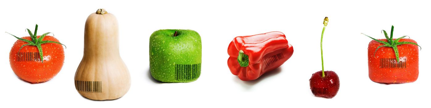 A selection of fruit and veg with barcodes on them isolated on white.