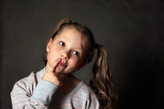 Portrait 5 years girl in studio