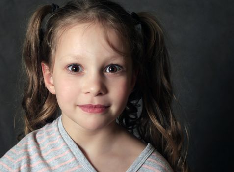 Portrait 5 years girl in studio