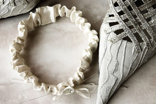 Toned image of wedding garter and shoe 