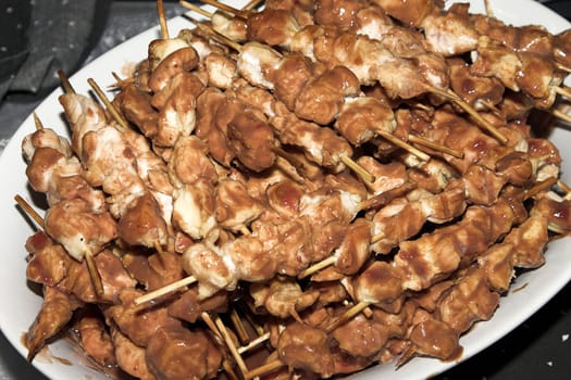 Baked Chicken Skewers on a white buffet plate