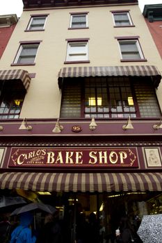 Hoboken, NJ - April 23, 2011: Welcome to Hoboken sign outside of Carlos Bakery the