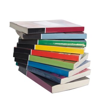 Isolated twisted stack of colorful real books on white background