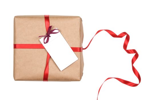 gift box with red ribbon and blank label on white background