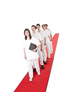 Medical Team on a red Carpet isolated on white background