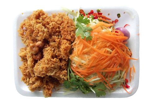 Catfish spicy with mango and carrot in Thai call "yam pla dook foo".It 's most popular food in Thailand.