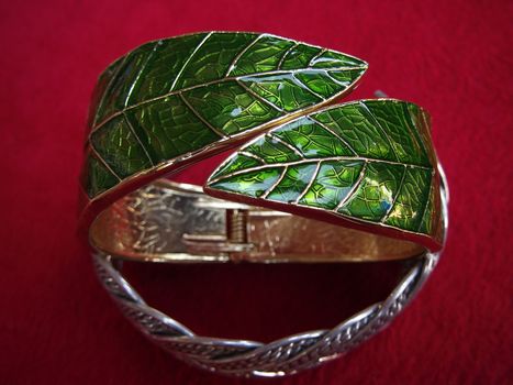 Bracelet leaf shape on red background