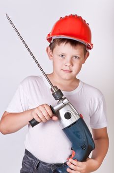 Portrait of a boy in a red protective helmet