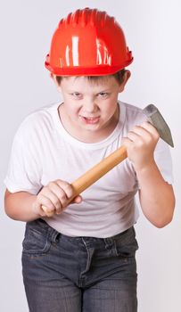 Portrait of a boy in a red protective helmet