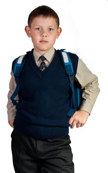 Schoolboy. Isolated over white background. The boy is dressed in a vest.