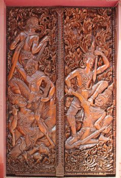 Buddhist temple door decoration in Paksong City, Champasak Province, Southern of Laos