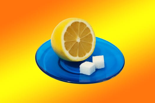 Lemon and two slices of sugar on a blue saucer. isolation on a colorful background.