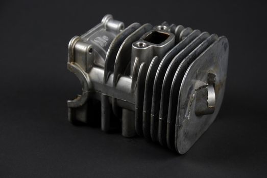 Stock pictures of a small gas engine and a carburetor