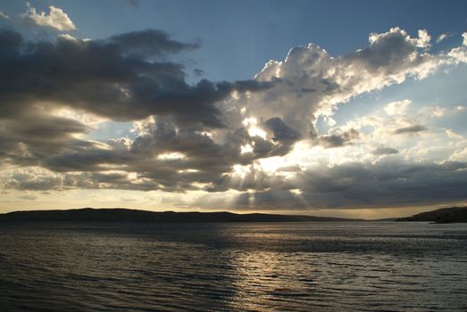 Sunset is decorated with lots of clouds.