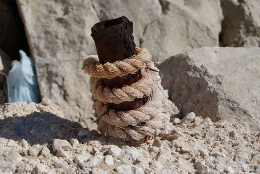 Rope used for tying ships in port. Tethered to a metal handle.