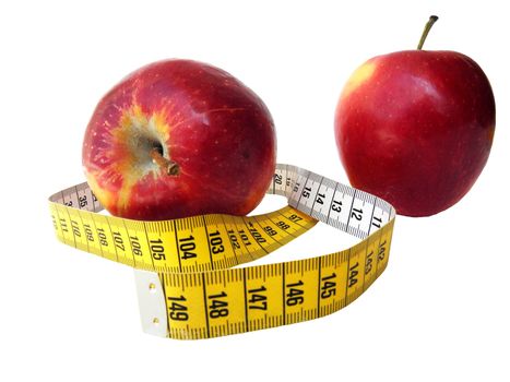 Two apples photographed with a meter to measure between them. Symbolically showing a healthy food and going on a diet.