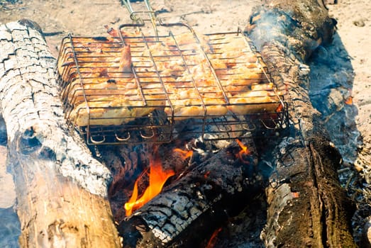 Chicken barbecue roasting on an open fire