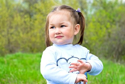 Baby girl on the meadow