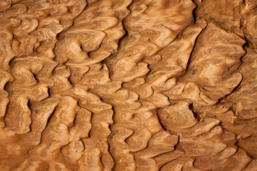 Beautiful rippled wet sand background or texture